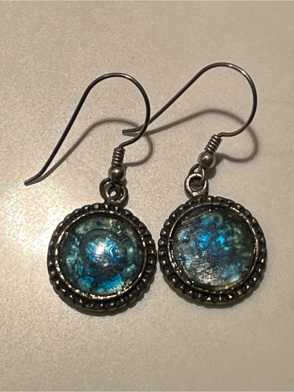 Gorgeous sterling silver wire earrings with blue stones.